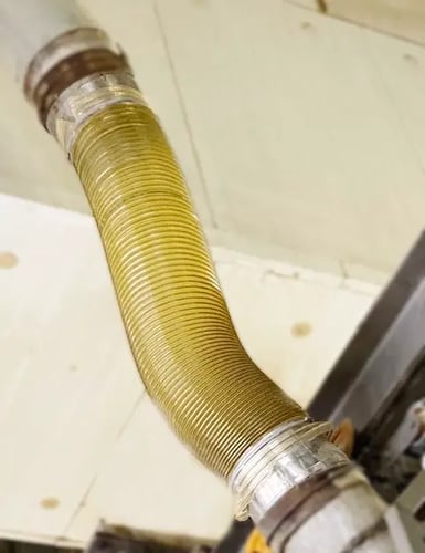 1.5m corrugated hose installed between the extruder & dryer