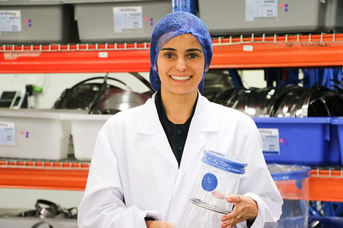 Fernanda holding a BFM® connector with a ring installed