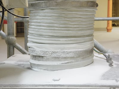 Leaking hose-clamped connector in a sugar plant