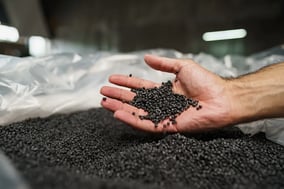 close-up-of-male-hand-holding-plastic-polymers