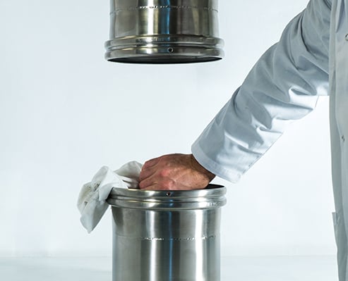 Person cleaning BFM® spigots with a cloth