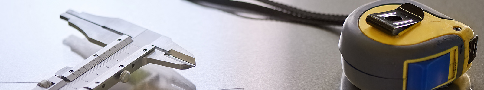 tape-measure-and-micrometer-close-up-1600x300